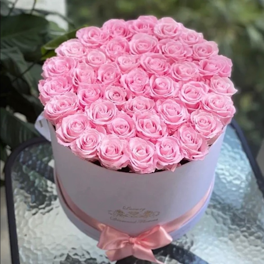 33 reserved roses in velvet round box (12x12x8). Real roses last for years